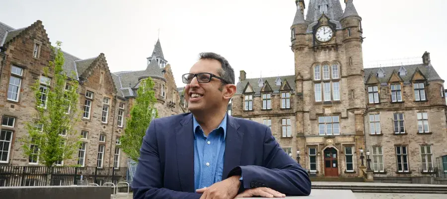 A photo of Professor Kev Dhaliwal outside of Edinburgh Futures Institute