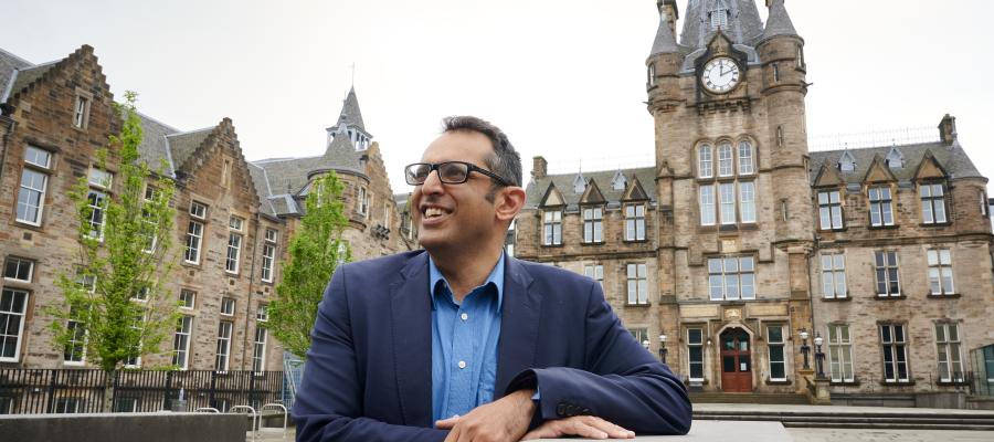 A photo of Professor Kev Dhaliwal outside of Edinburgh Futures Institute